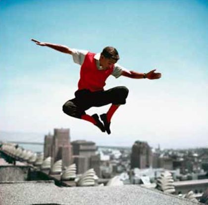 Sammy Davis Jr In Mid-air by Frank Worth