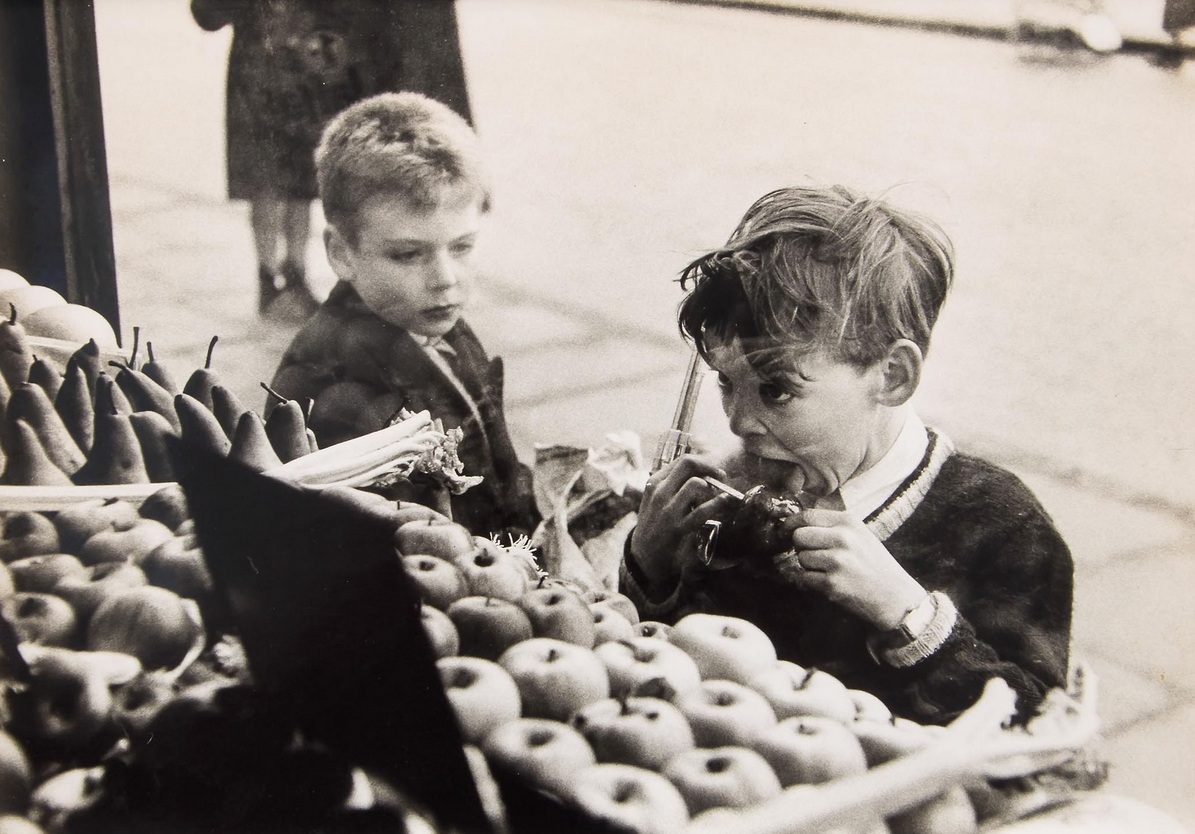 Untitled (Child with Toffee Apple and Gun) by Bert Hardy