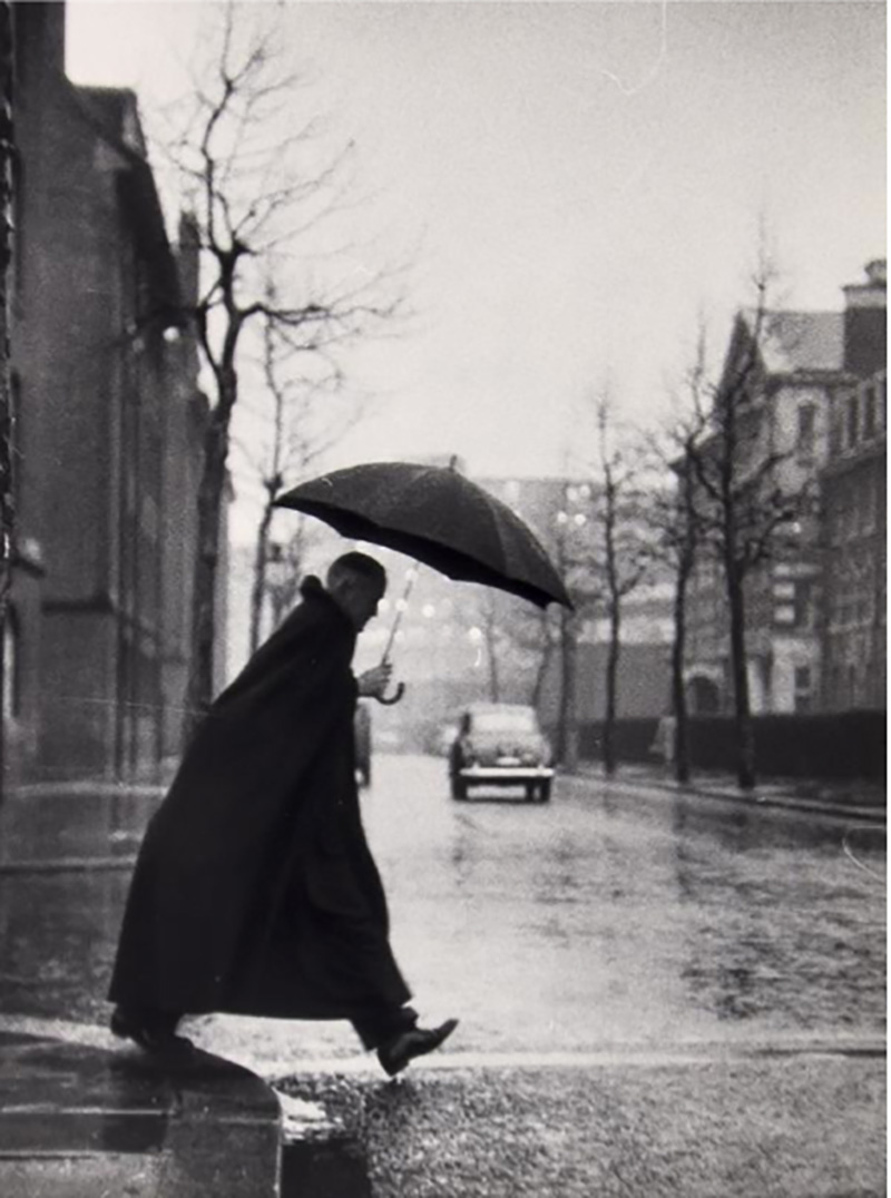 The Rev. Rhinedorp, Vicar of Pimlico, steps out by Thurston Hopkins