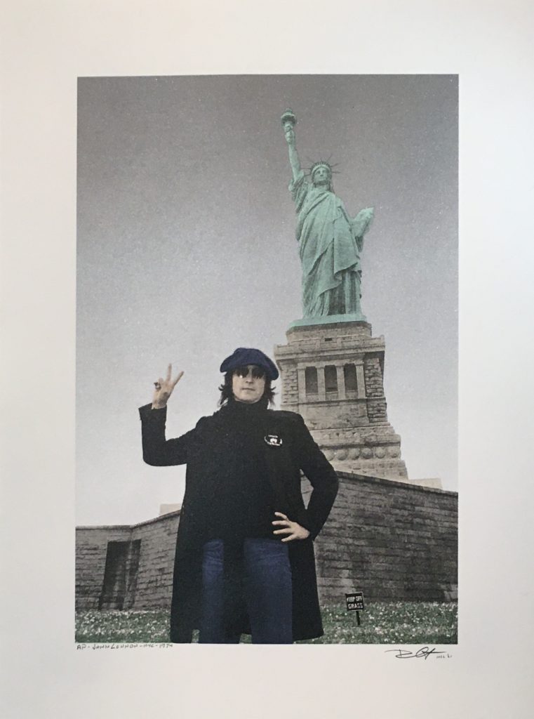 John Lennon, Statue of Liberty, New York City by Bob Gruen