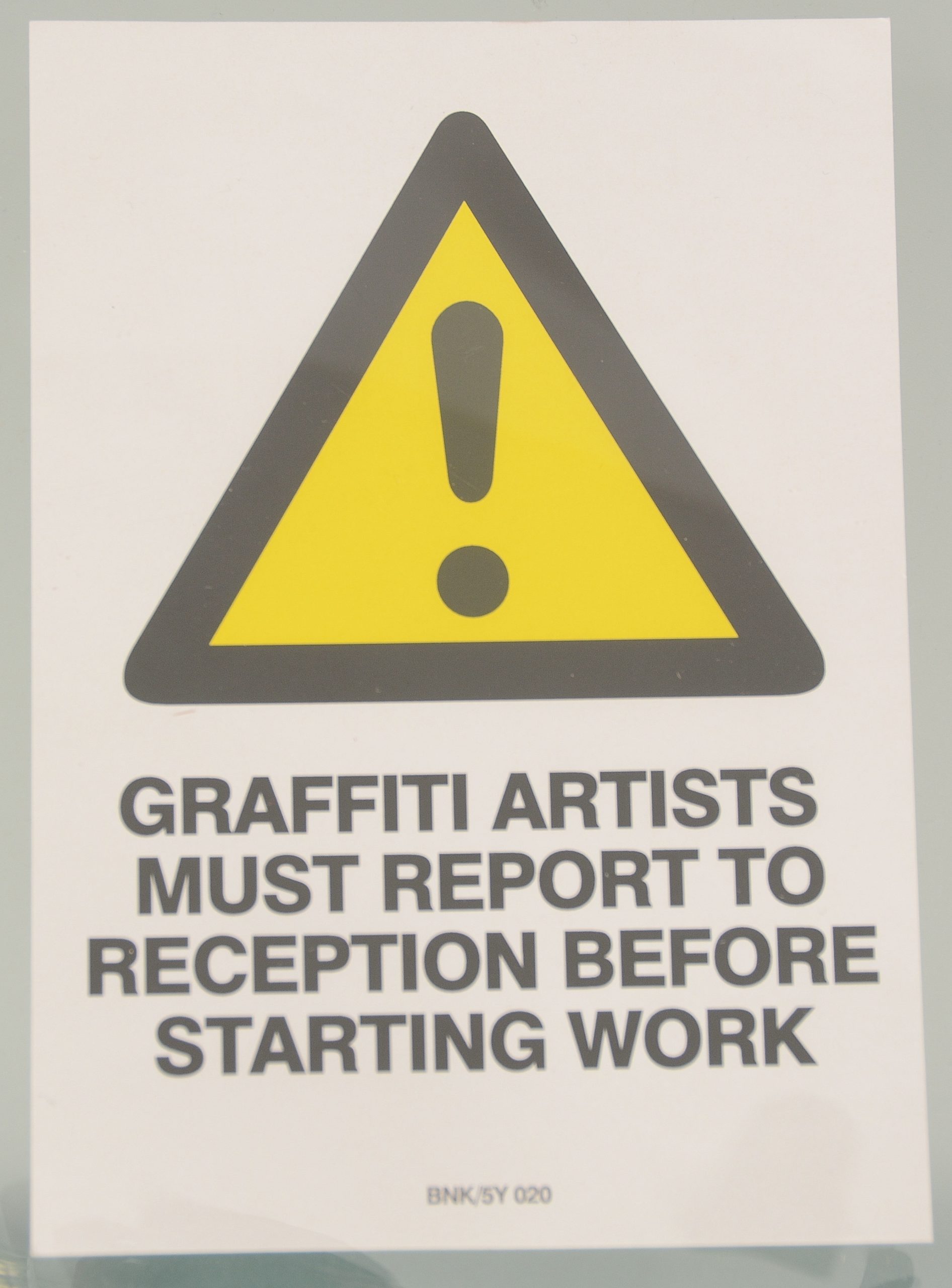 Graffiti Artists Must Report to Reception by Banksy