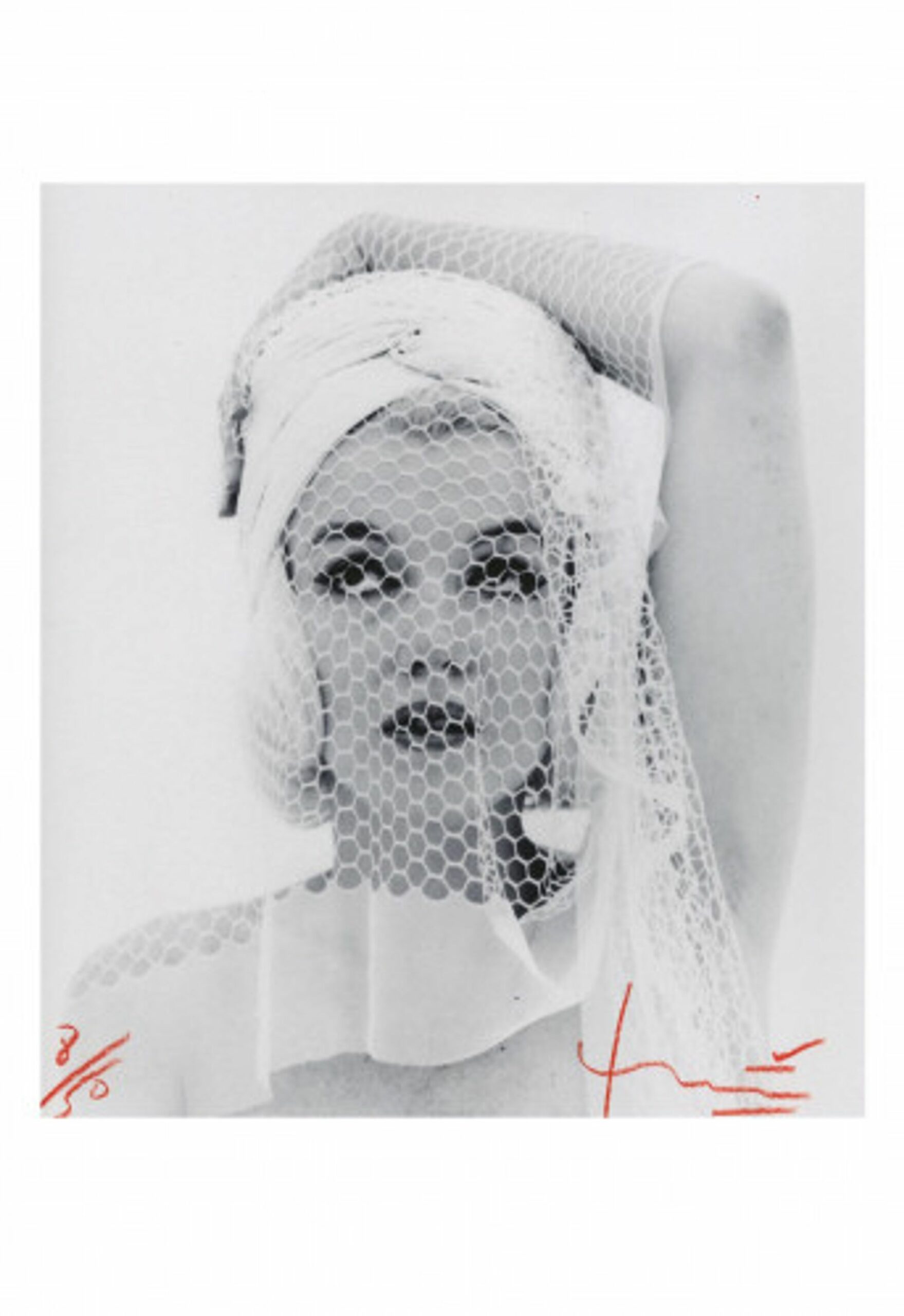 Marilyn looking up in the wedding veil by Bert Stern