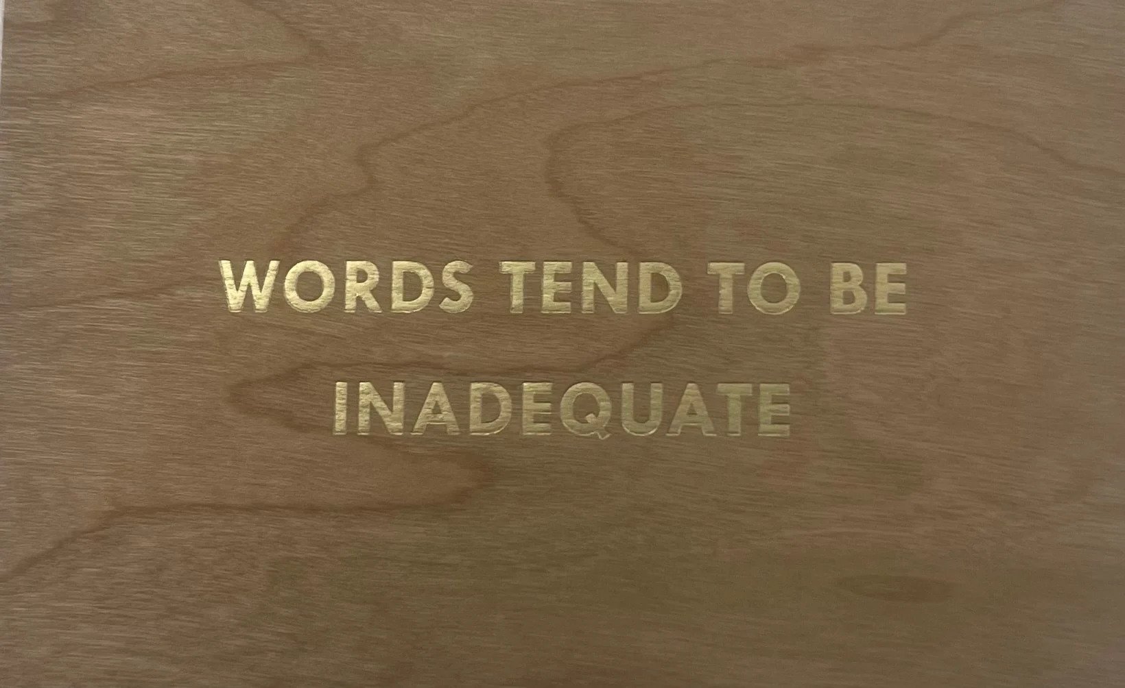 Words Tend To Be Inadequate- Gold (Truism Series) by Jenny Holzer