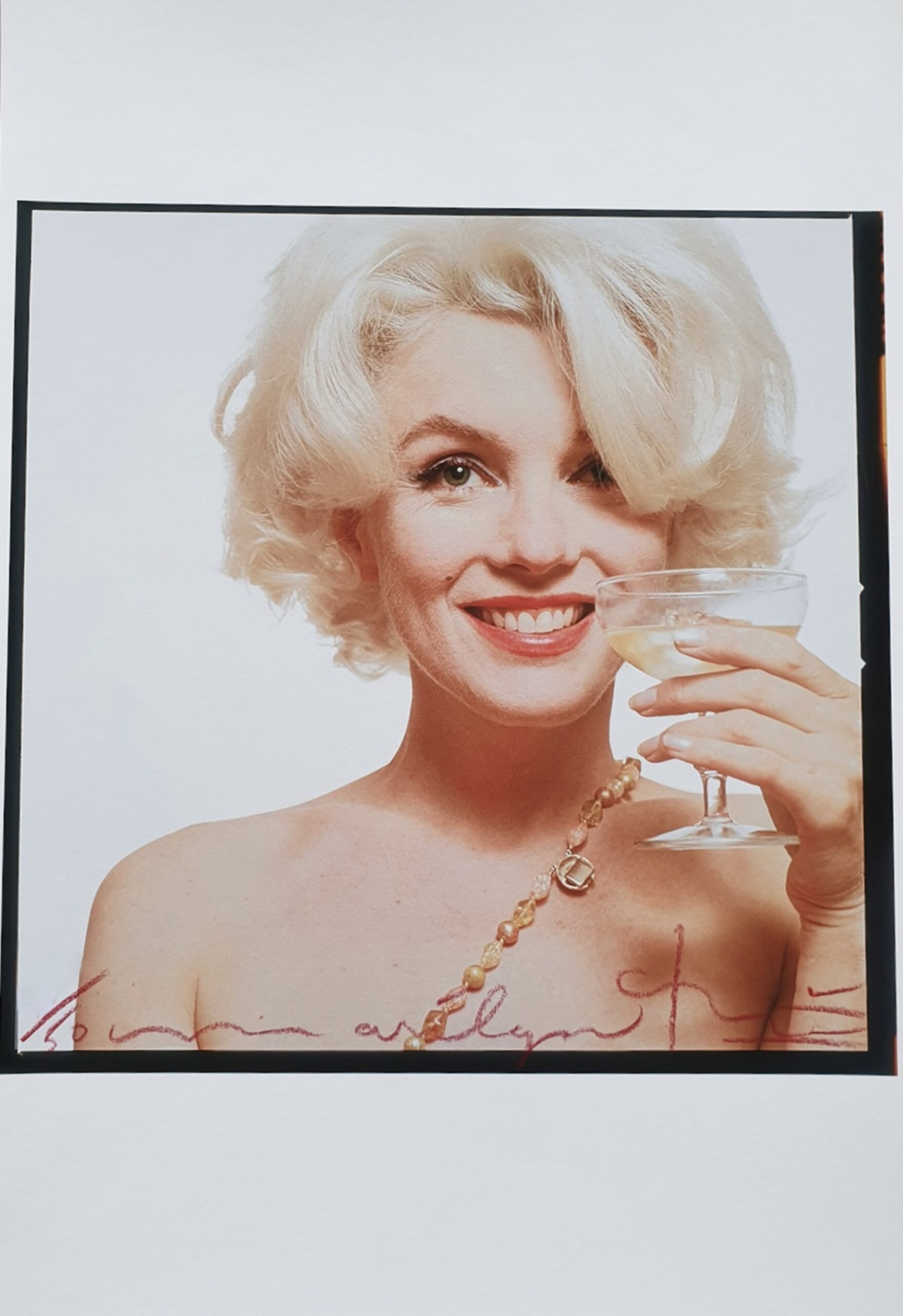 Marilyn and champagne by Bert Stern